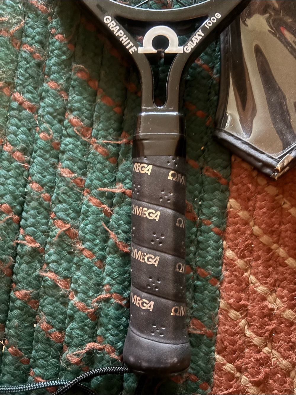 Omega Black Racketball Racket with Red and Yellow Accents - Picture 4 of 6